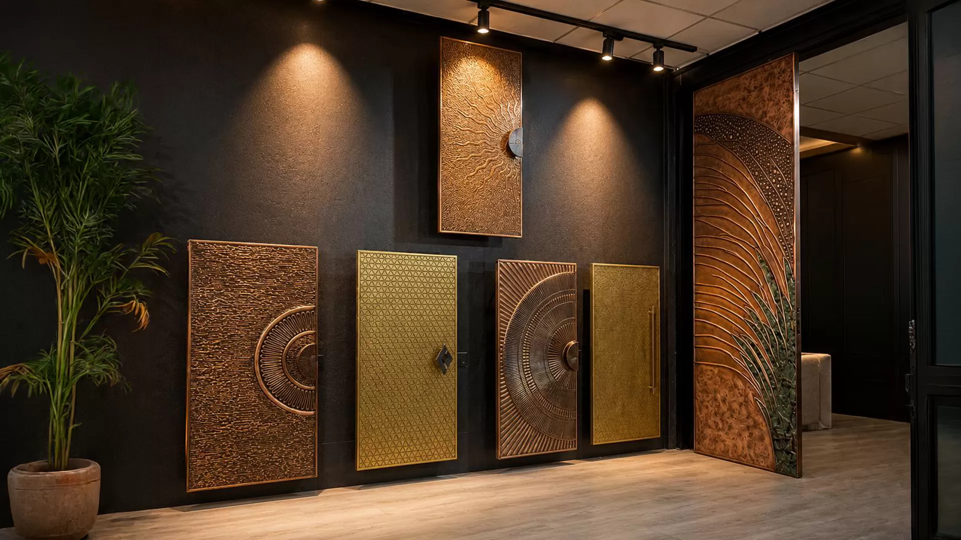 Artisan hand-finishing an intricate metal mural surface