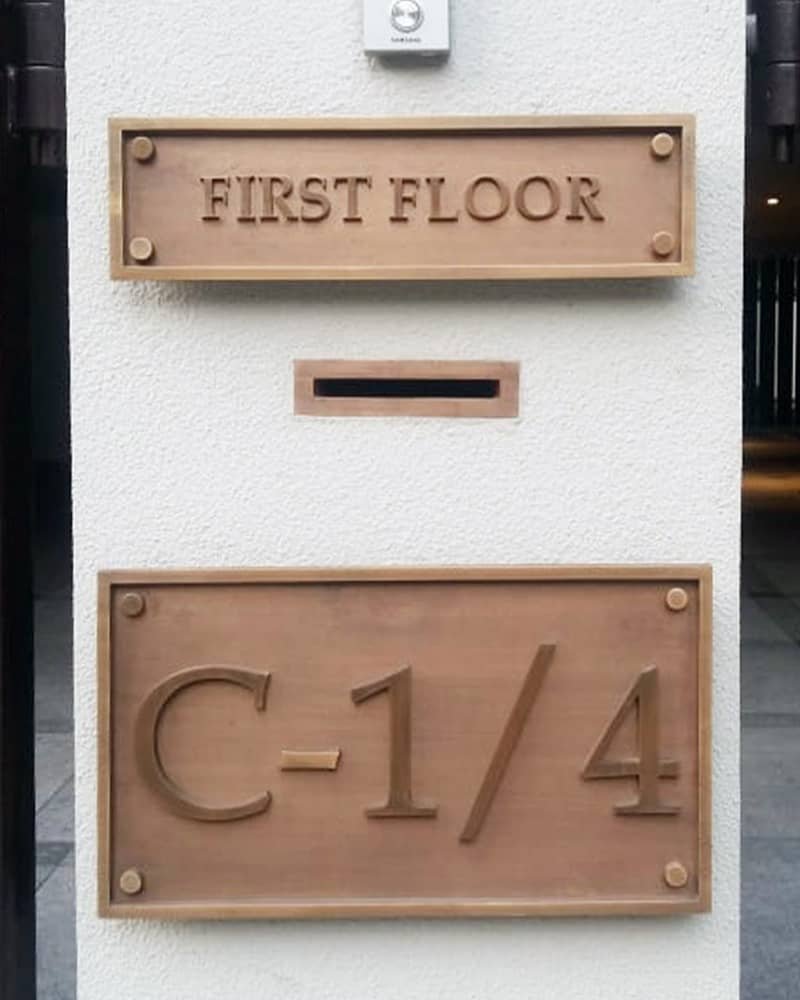 Brass name plate with laser-cut typography